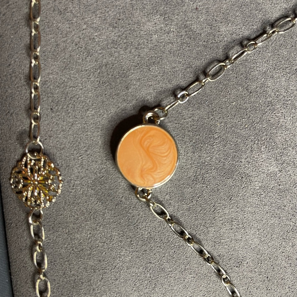 Beautiful costume jewelry necklace with peach-ISH pendants